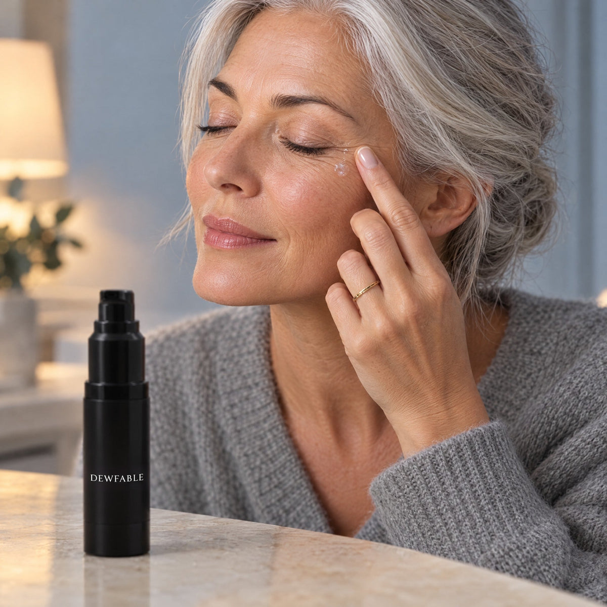 Patting Firm Face & Eye Serum near the eye at night