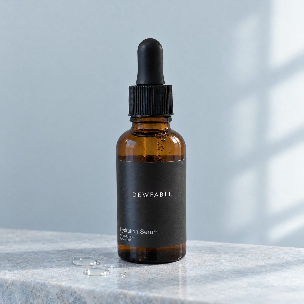 Hydration Serum on a pale stone ledge