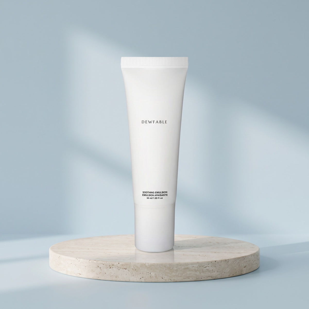 Soothing Emulsion tube on a pale stone plinth