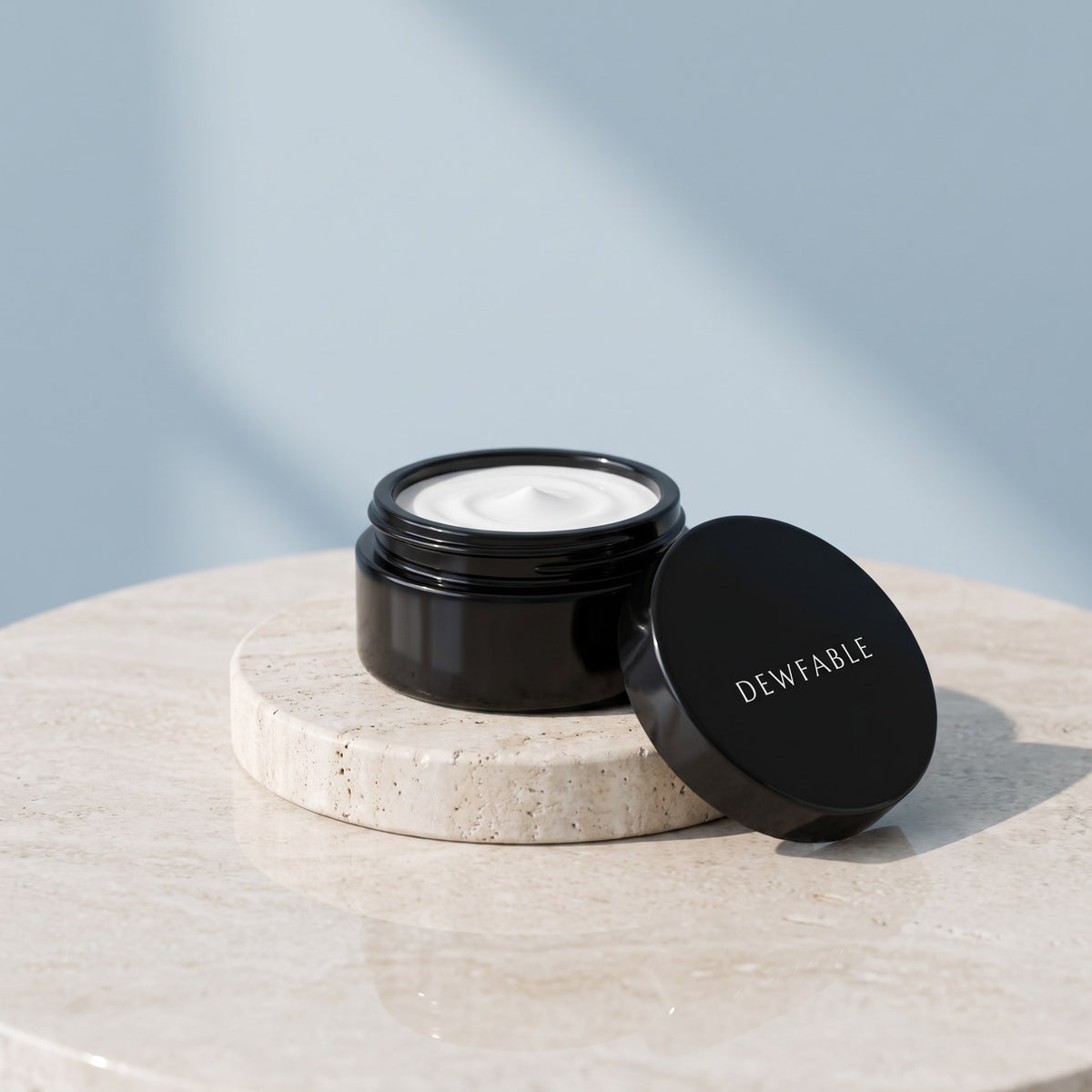 Active Eye Cream jar and lid on a pale stone plinth