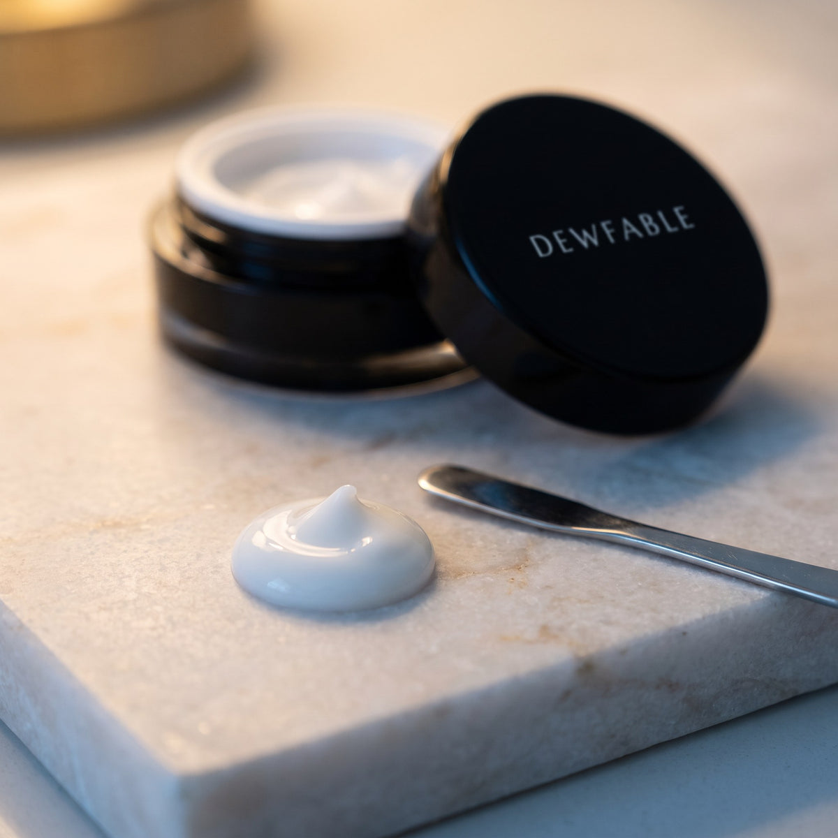 A dollop of Active Eye Cream with a spatula