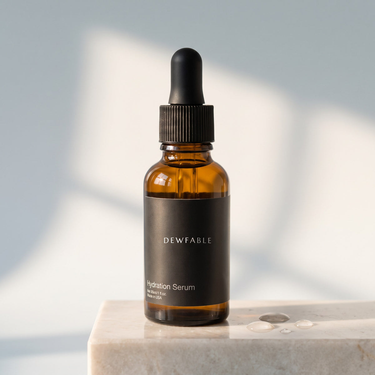 Hydration Serum on a pale marble block