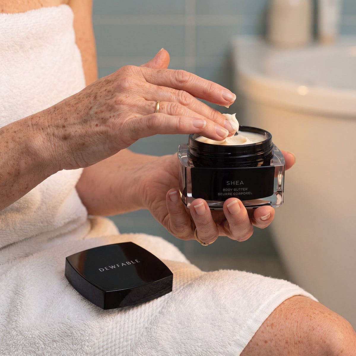 Scooping Shea Body Butter from the jar