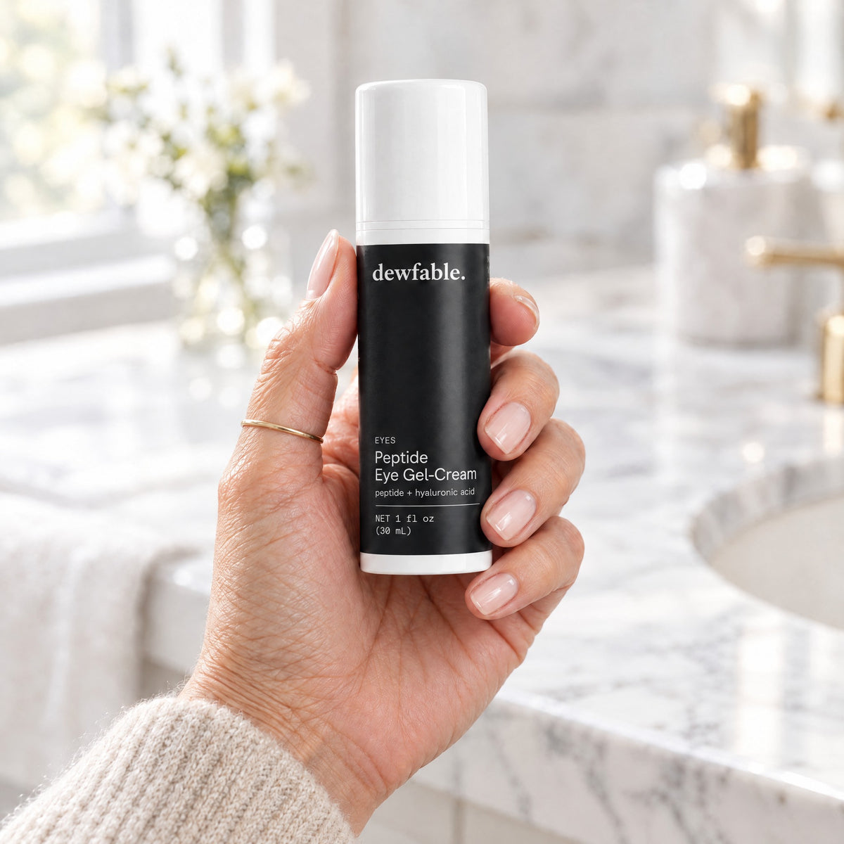 dewfable. Peptide Eye Gel-Cream, held in a hand