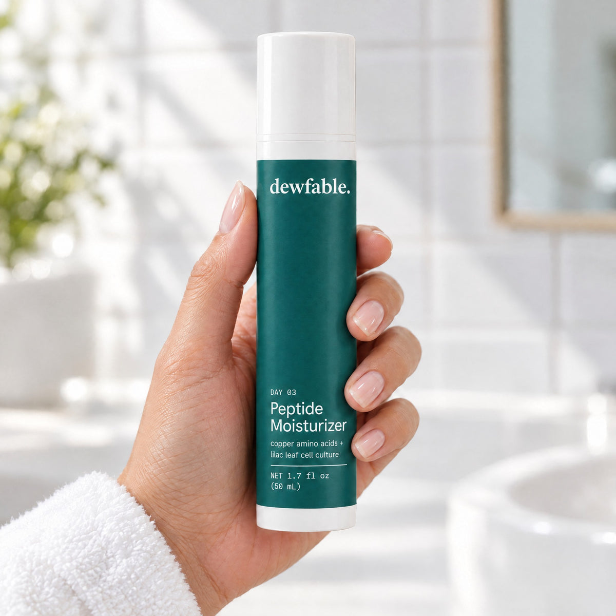dewfable. Peptide Moisturizer, held in a hand
