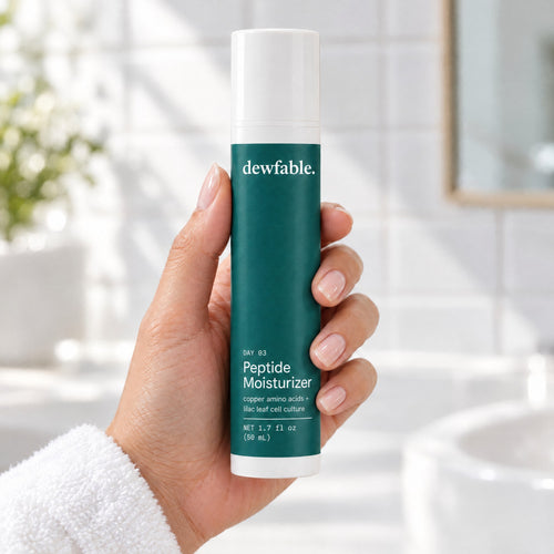 dewfable. Peptide Moisturizer, held in a hand