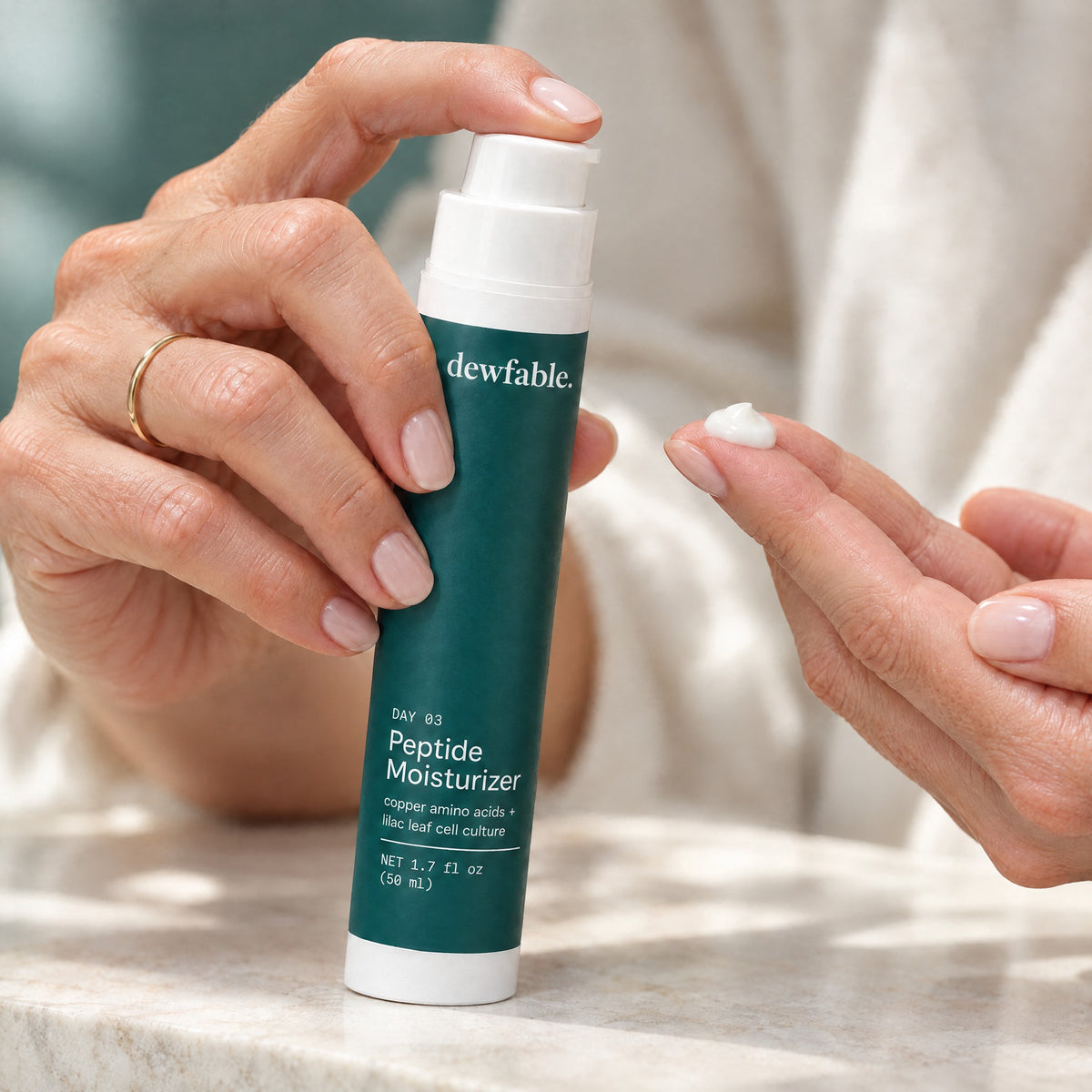 dewfable. Peptide Moisturizer, pump with a dollop of cream