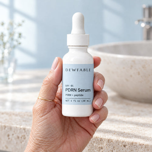 dewfable. PDRN Serum, held in a hand